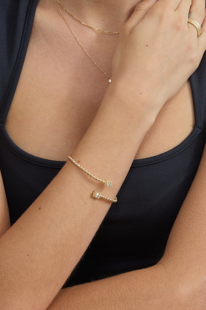 open bangle with ball design and diamonds