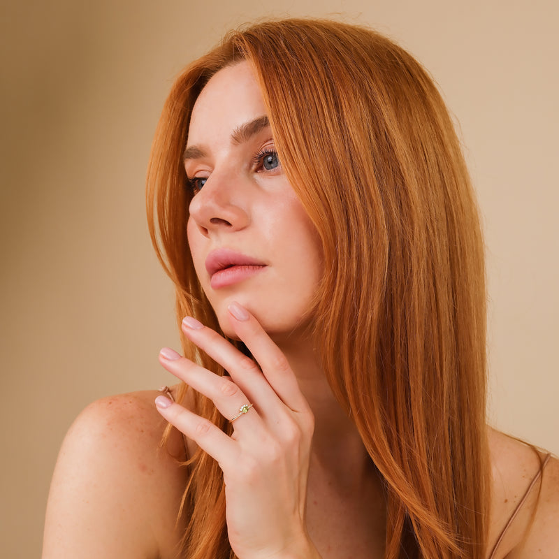 oval peridot with round white diamonds