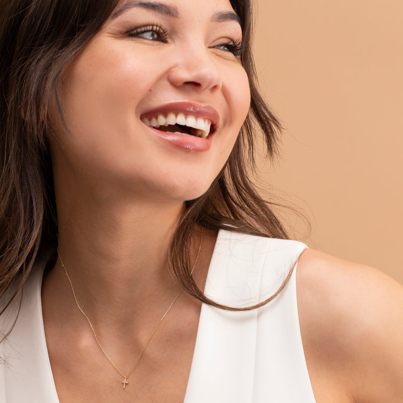 dainty ethically sourced diamond lined cross pendant