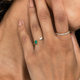 engagement toi et moi ring with emerald