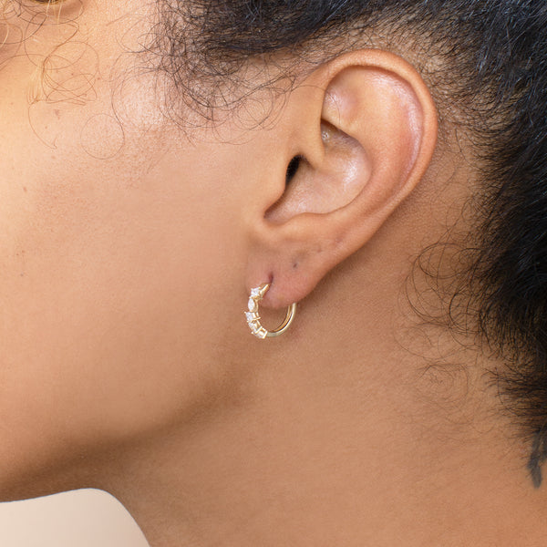 solid gold hoop earrings with mixed white diamonds in different cuts