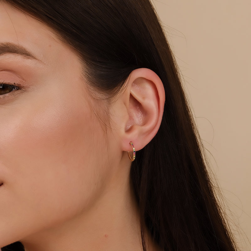 model wears 14k solid gold rainbow sapphire dainty handmade hoop earrings 