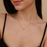 dainty diamond butterfly outline necklace in solid gold