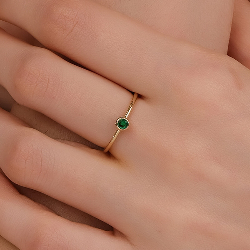 bezel set emerald ring