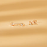 Pair of solid 14k gold with single diamond stud in eye shape