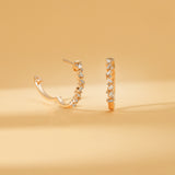 Pair of solid 14k gold stacked baguette diamond earring hoops 