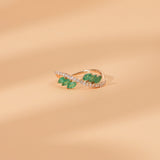 marquise emerald round diamond ring