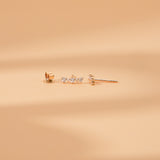 Sideview of handmade natural diamond curved bar stud earring