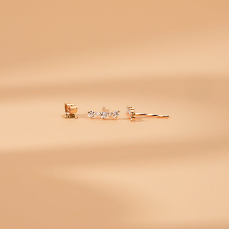 Sideview of handmade natural diamond curved bar stud earring