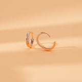 open clasp side view of diamond lined x- shape hoop earrings in solid 14k gold