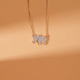 Gold lucky elephant necklace with diamond accents for good fortune