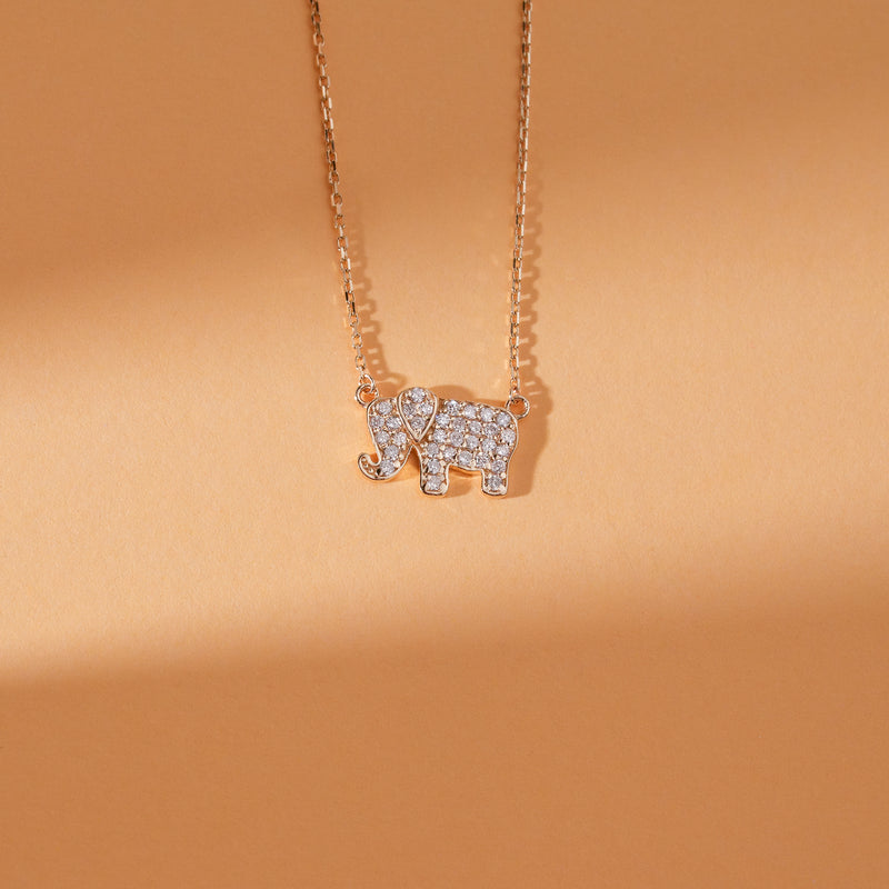 Gold lucky elephant necklace with diamond accents for good fortune