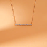 Long vertical bar necklace with pave diamonds in 14k gold