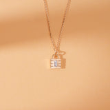 Padlock necklace with diamond, symbolizing love and commitment