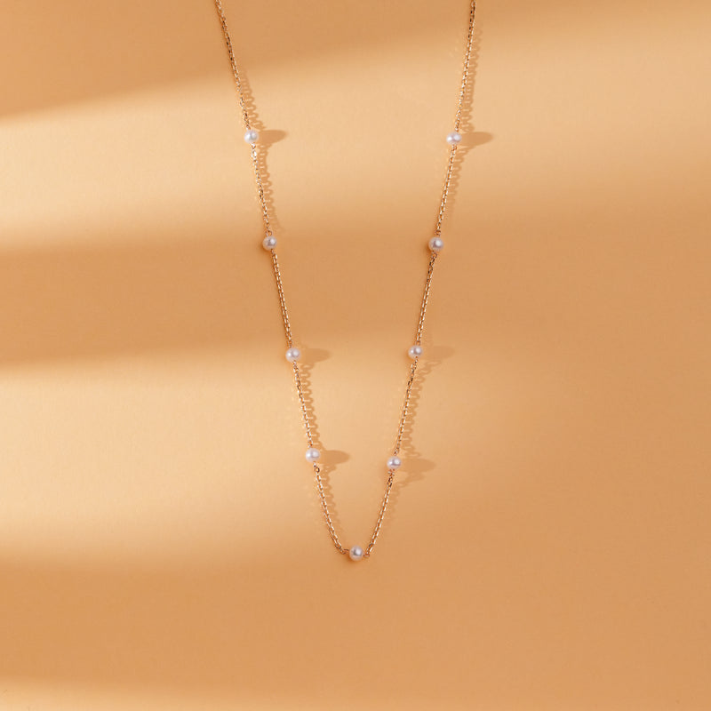 Classic and elegant natural pearl station necklace for timeless style.