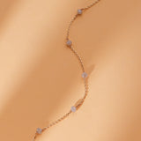 solid gold cable chain station bracelet with salt and pepper diamonds