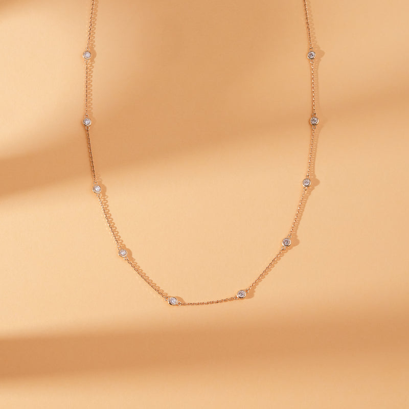 dainty solid gold diamond by the bezel necklace 