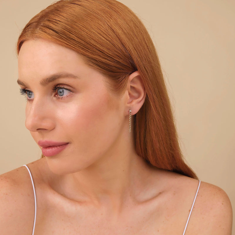 Model wears ethically sourced fine jewelry diamond stud with cuban chain link in solid 14k gold gift for her 