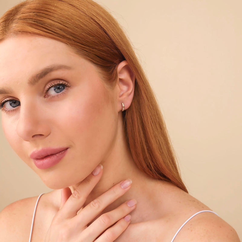 Model wears 14k solid gold spiked pyramid design with April birthstone natural diamonds gift for her