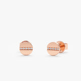 Handcrafted pair of solid 14k rose gold flat circle stud earrings with lined paved diamonds
