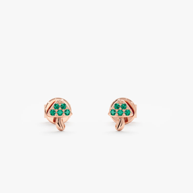 Pair of handmade mushroom stud earrings with emeralds in solid 14k rose gold.  