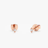 handmade pair of solid 14k rose gold eye shape stud earrings with single diamond 