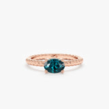 14k rose gold oval cut teal sapphire ring with twisted band