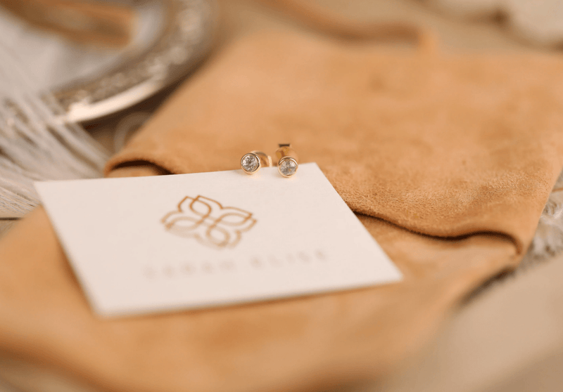 ethicaly sourced white sapphire studs in solid gold