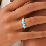 Cymbria Discover effortless sophistication with our Natural Turquoise & Lab Grown Diamond Ring. Crafted in lustrous solid gold, this exquisite band features a captivating arrangement of vibrant square natural turquoise cabochons, each meticulously bezel-s