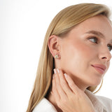 Vexa Infuse your style with the elegant rhythm and timeless beauty of our Gold Floral Diamond Accent Studs. This exquisite pair is meticulously crafted in lustrous solid gold, showcasing a graceful multi-petal flower motif with a highly polished finish. A