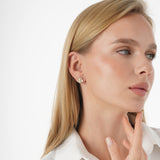 Vexa Infuse your style with the elegant rhythm and timeless beauty of our Gold Floral Diamond Accent Studs. This exquisite pair is meticulously crafted in lustrous solid gold, showcasing a graceful multi-petal flower motif with a highly polished finish. A