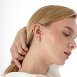 Vexa Infuse your style with the elegant rhythm and timeless beauty of our Gold Floral Diamond Accent Studs. This exquisite pair is meticulously crafted in lustrous solid gold, showcasing a graceful multi-petal flower motif with a highly polished finish. A