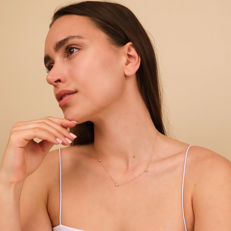 Delicate diamond ball necklace, perfect for layering or everyday wear.