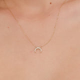 Gold crescent moon necklace with pave diamonds