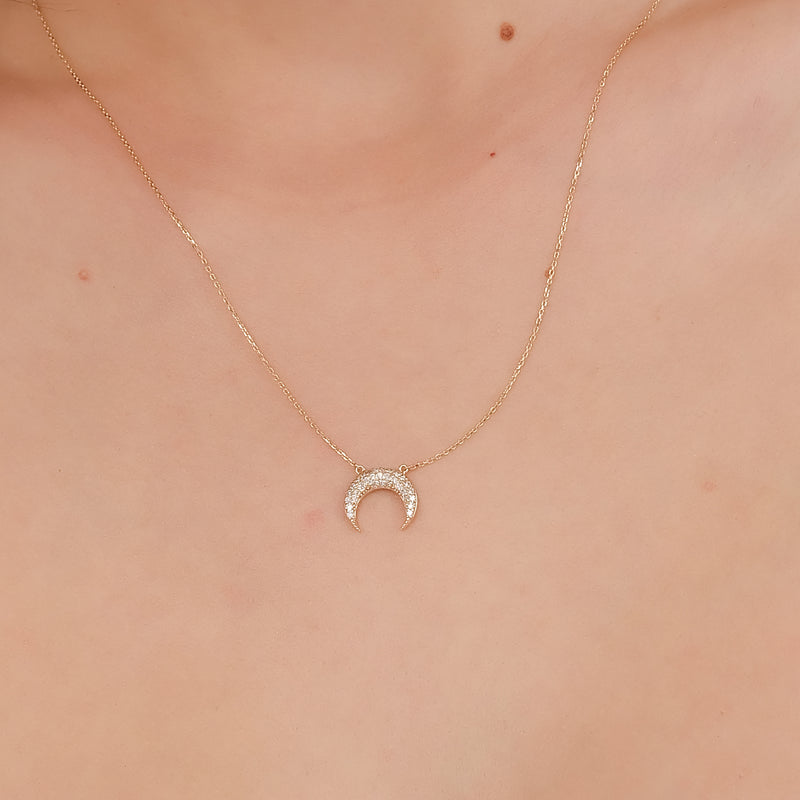 Gold crescent moon necklace with pave diamonds