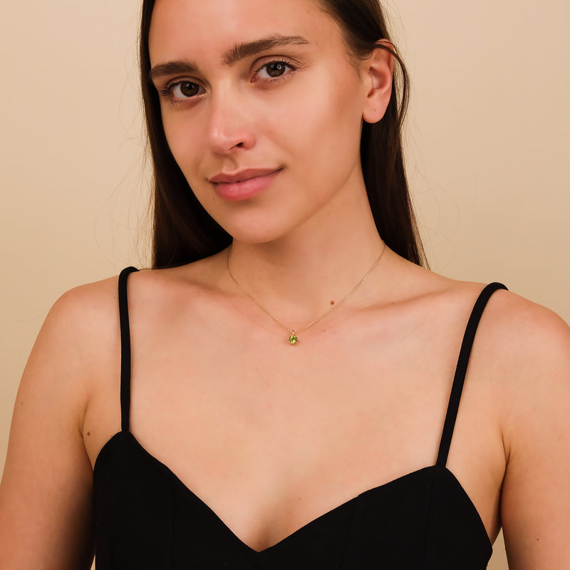 Green peridot necklace on gold chain