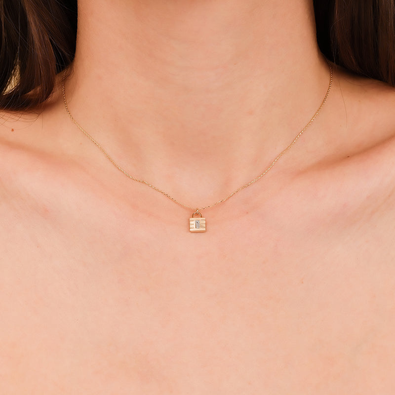 14k gold necklace with padlock pendant and single diamond accent