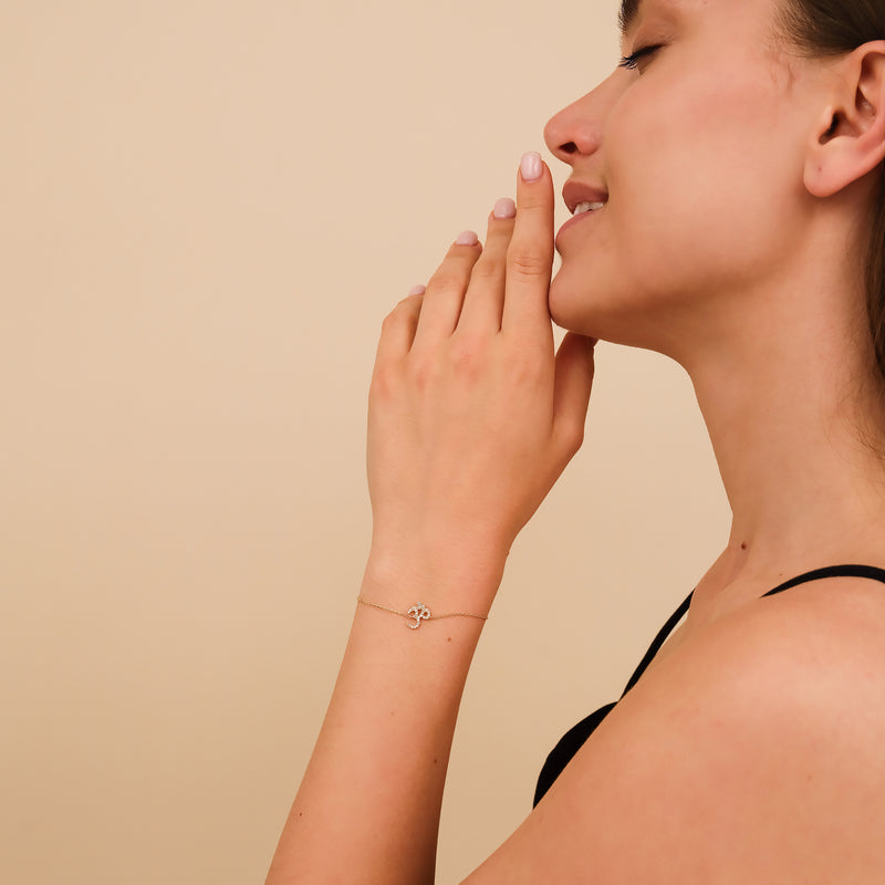 Diamond and gold OM mantra bracelet for spiritual style.