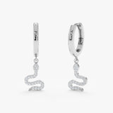 Pair of solid white gold 14k huggie earrings with diamond lined snake charm 