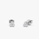handcrafted pair of solid 14k white gold three bezel diamond studs
