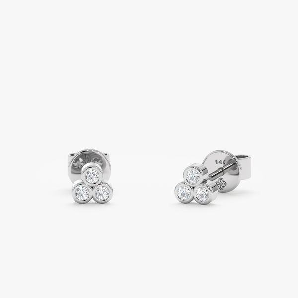 handcrafted pair of solid 14k white gold three bezel diamond studs