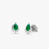 Delicate pear-cut emerald and diamond studs in 14k/18k white gold. A thoughtful gift for women.