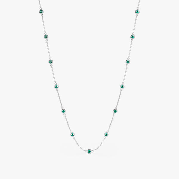 Luxurious emerald and white gold station necklace