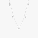 Solid gold necklace featuring five dangling lightning bolt charms.
