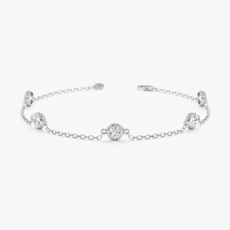 Bezel-set diamond bracelet on a white gold chain.