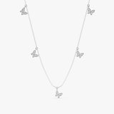solid white gold necklace with multiple diamond paved butterfly charms