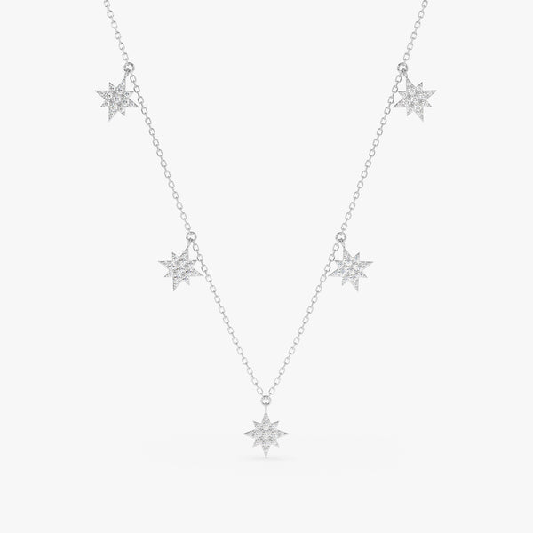 handcrafted solid white gold necklace with multiple hanging north star diamond charms
