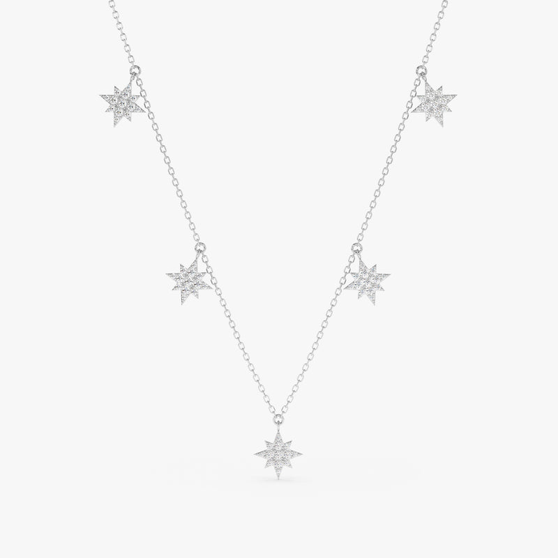 handcrafted solid white gold necklace with multiple hanging north star diamond charms