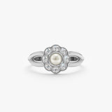 solid white gold pearl and diamond daisy ring