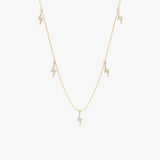 handmade solid gold hanging lightning bolt charms with paved diamonds